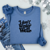 Gildan Indigo Blue sweatshirt with 'I don't winter well' text on a light background with snowflakes and jeans.