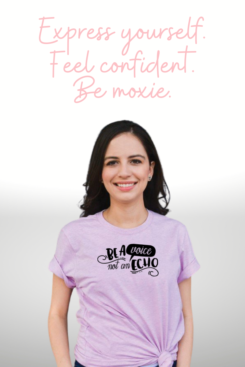Woman wearing a Bella Canvas 3001cvc t-shirt in lilac with Be a Voice not an Echo in black text.