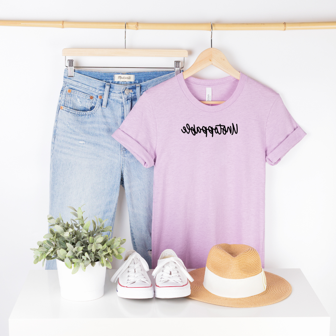 Bella Canvas 3001cvc lilac heather t-shirt with Unstoppable in black script backwards as part of Moxie Momma's Exclusive Reflection line.