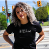 A woman wearing a Bella Canvas t-shirt in Heather black with The original OC (only child) in white lettering. Part of Moxie Momma's exclusive only child line.