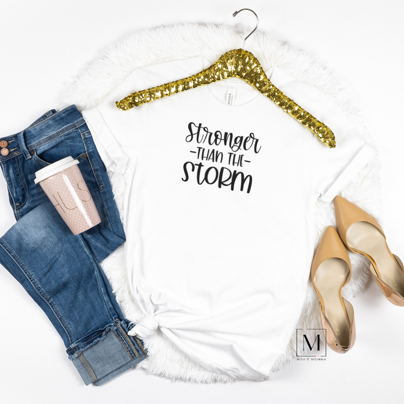White Bella Canvas Tee with black hand-lettering reading Stronger than the Storm. Sold by Moxie Momma