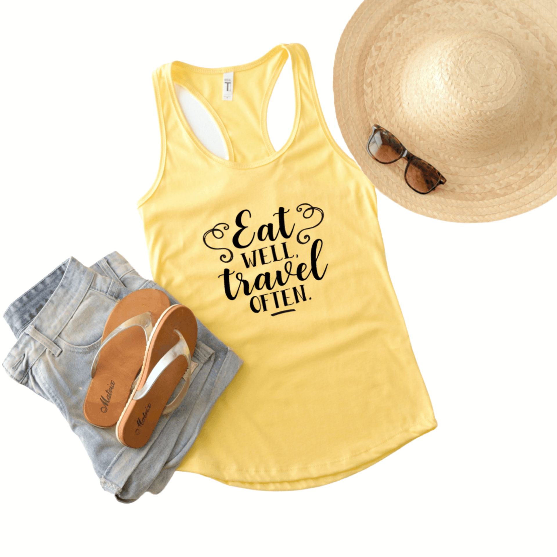 Eat well, travel often in black lettering on a banana (yellow) Next Level 1533 tank top.