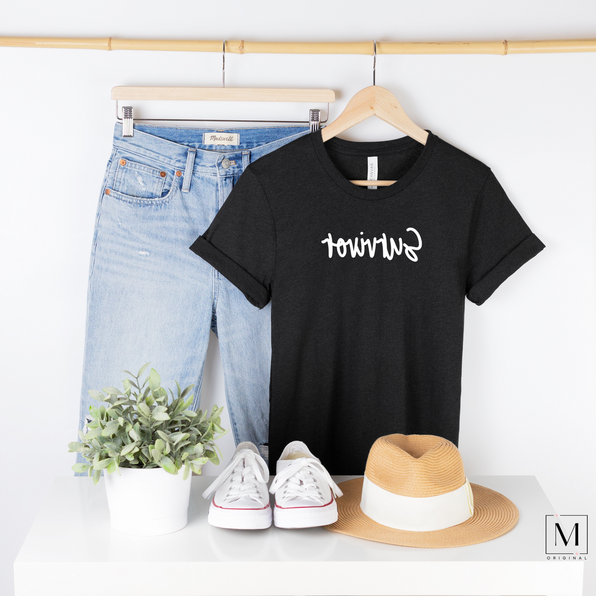 Bella Canvas 3001cvc black heather t-shirt with Survivor in white script backwards as part of Moxie Momma's Exclusive Reflection line.