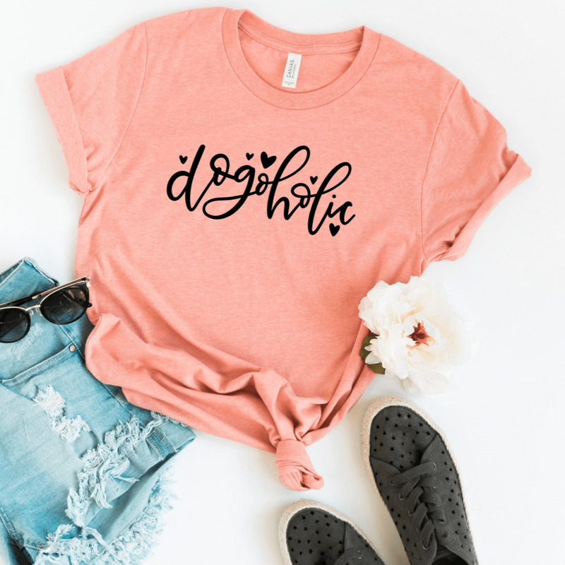 A bella canvas heather sunset t-shirt with Dogoholic with hearts in black.