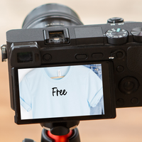 A camera with screen displaying the item as a reflection with the text reading Free.