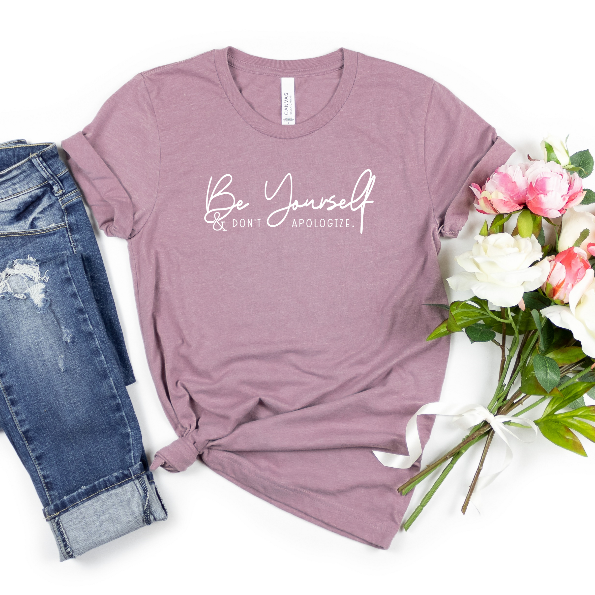 Be yourself & don't apologize in white heat transfer vinyl on a Bella Canvas heather orchid tee. Part of Moxie Momma's inspirational line.