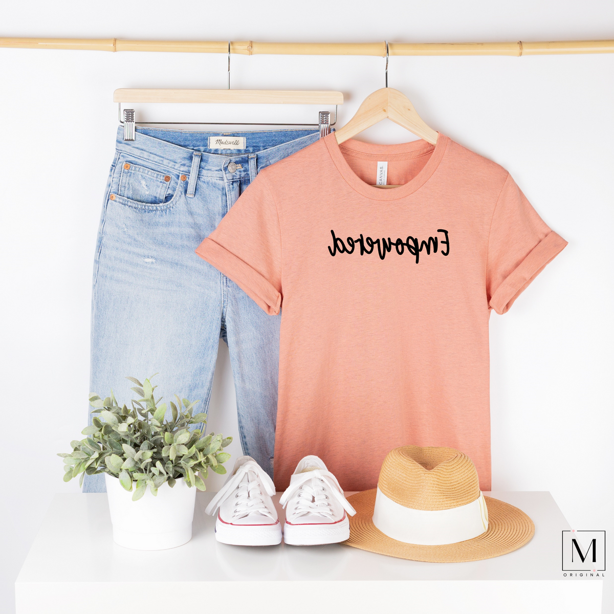 BC3001cvc - heather prism sunset t-shirt with Empowered in black script backward. Part of the Moxie Momma Reflection line.