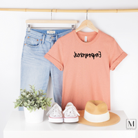 BC3001cvc - heather prism sunset t-shirt with Empowered in black script backward. Part of the Moxie Momma Reflection line.
