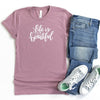 Life is beautiful in white hand-lettered script on a heather orchid bella canvas 3001cvc t-shirt.